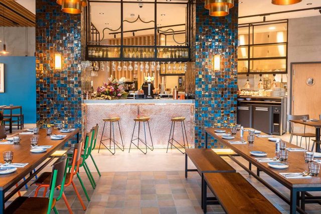 The modern bar interior at Masalchi by Atul Kochhar, an Indian street food restaurant in Wembley Park.